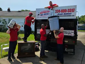 Team standing by bulk trash truck