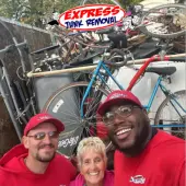 Team with happy customer after clearing out estate