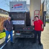Client and team member standing by truck