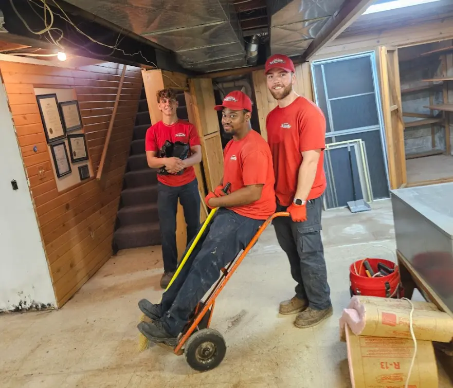 Express Junk Removal team removing junk from basement