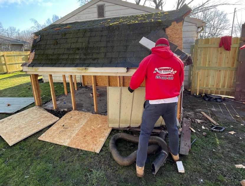 shed being demolished by junk team member