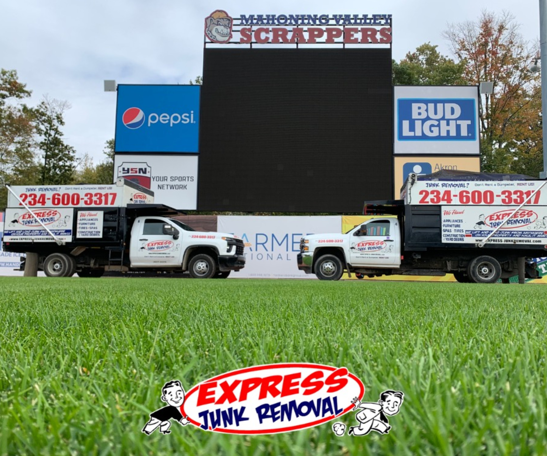Express Junk Removal trucks on the Mahoning Valley Scrappers baseball field in Niles, Ohio